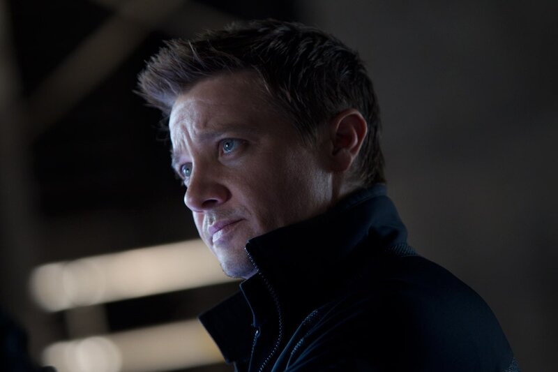 man in dark jacket looking away