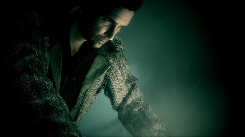 man in dark jacket looking down