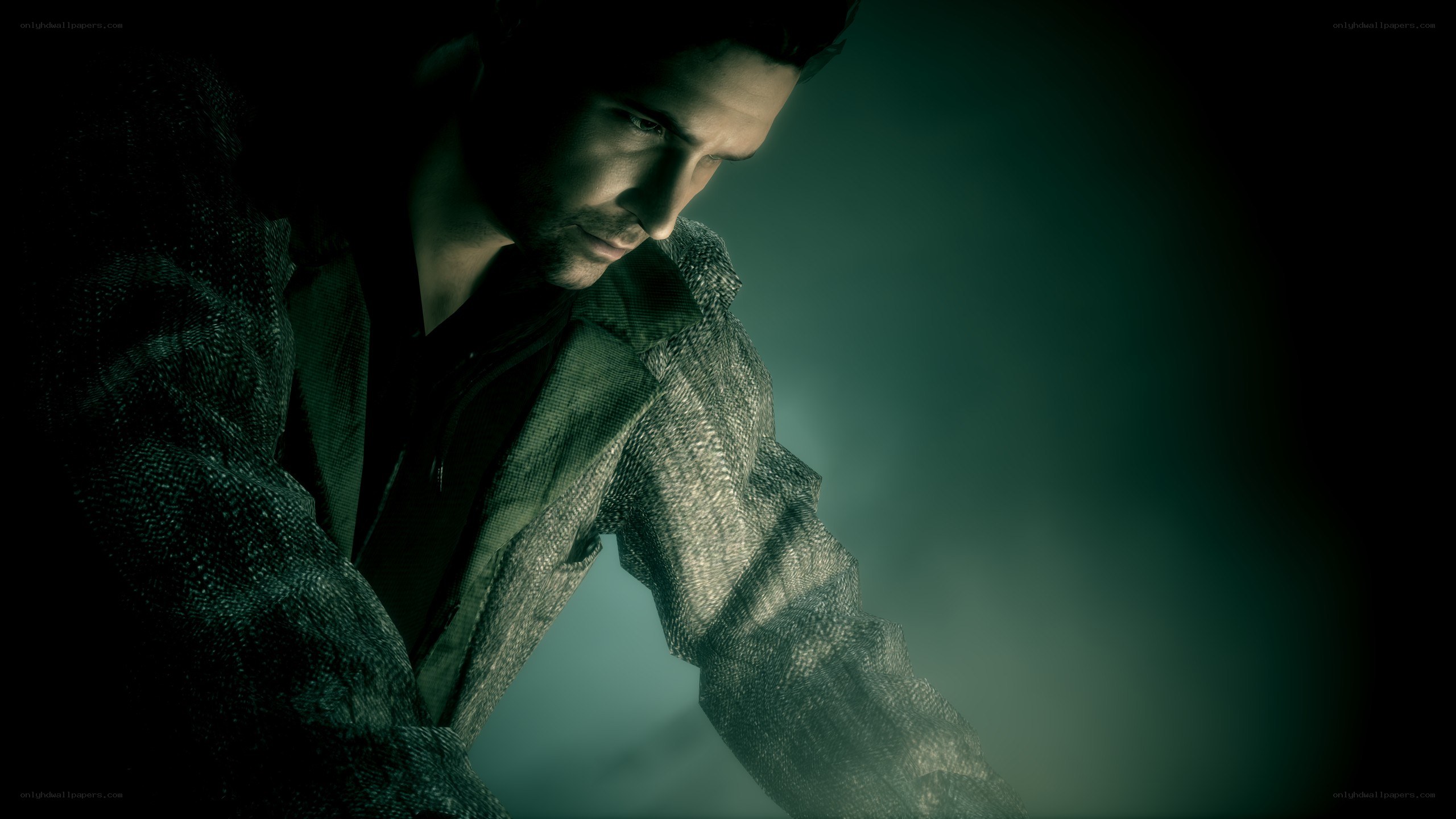 man in dark jacket looking down
