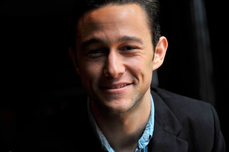 man in dark jacket smiling