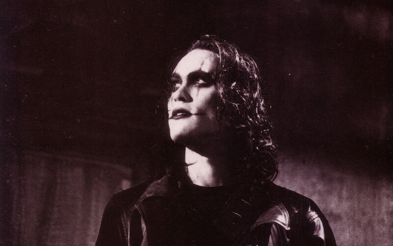 man in dark makeup looking up