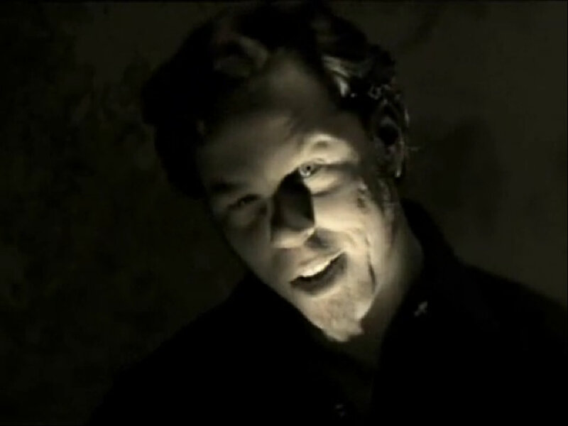 man in dark room with flashlight