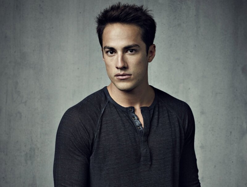 Man in Dark Shirt — Gray, Serious, Photograph