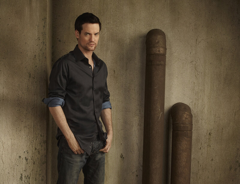 Man in Dark Shirt — Gray, Serious