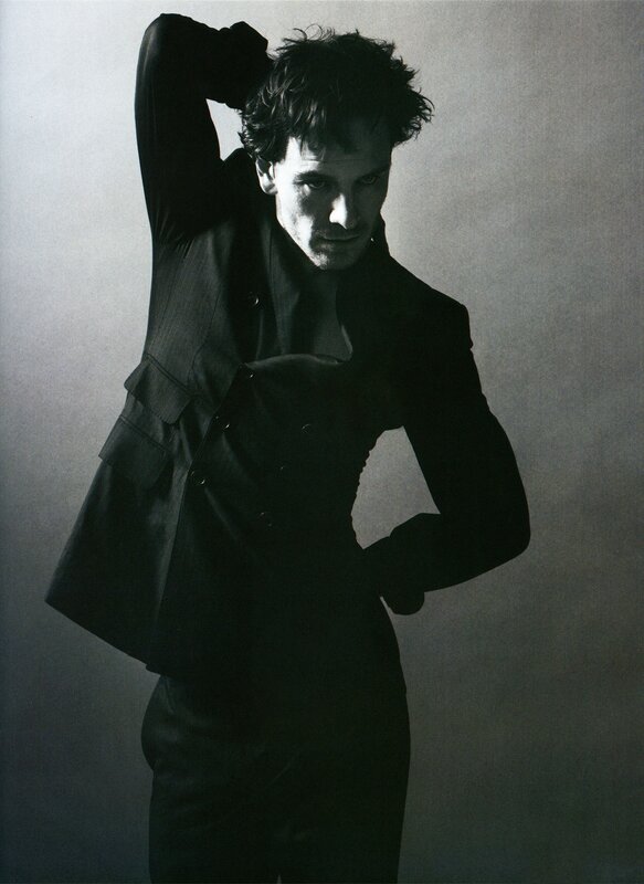 man in dark suit posing