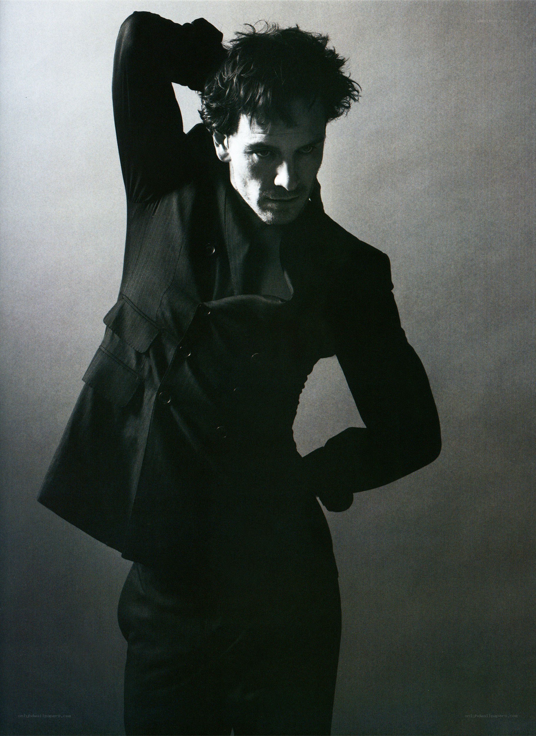 man in dark suit posing