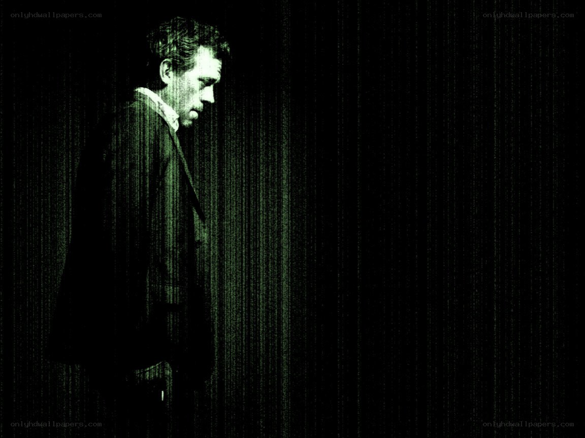 man in dark suit standing