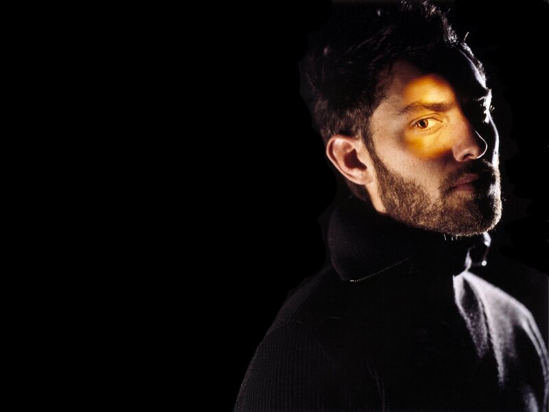 man in dark turtleneck