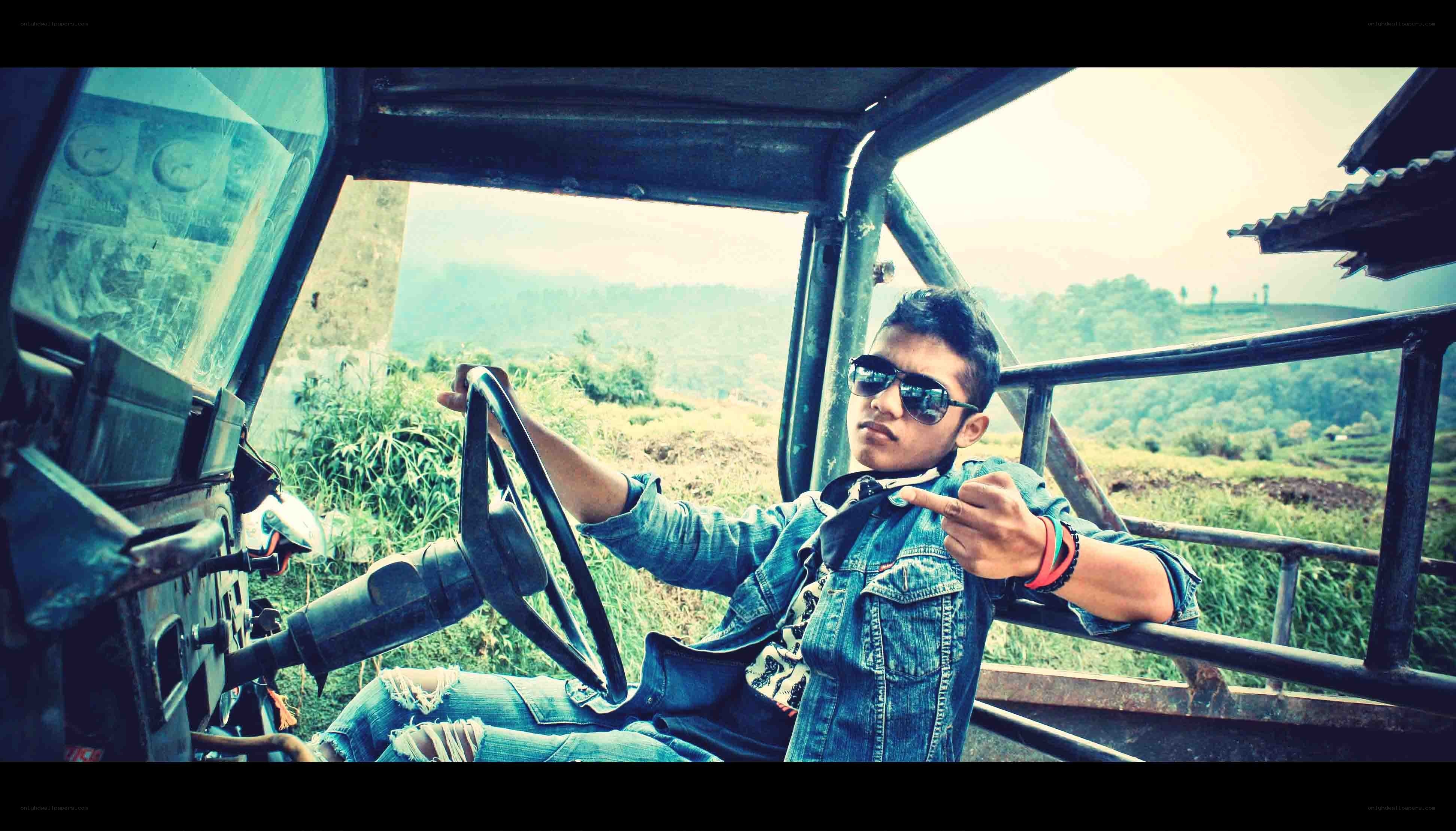man in denim driving vehicle