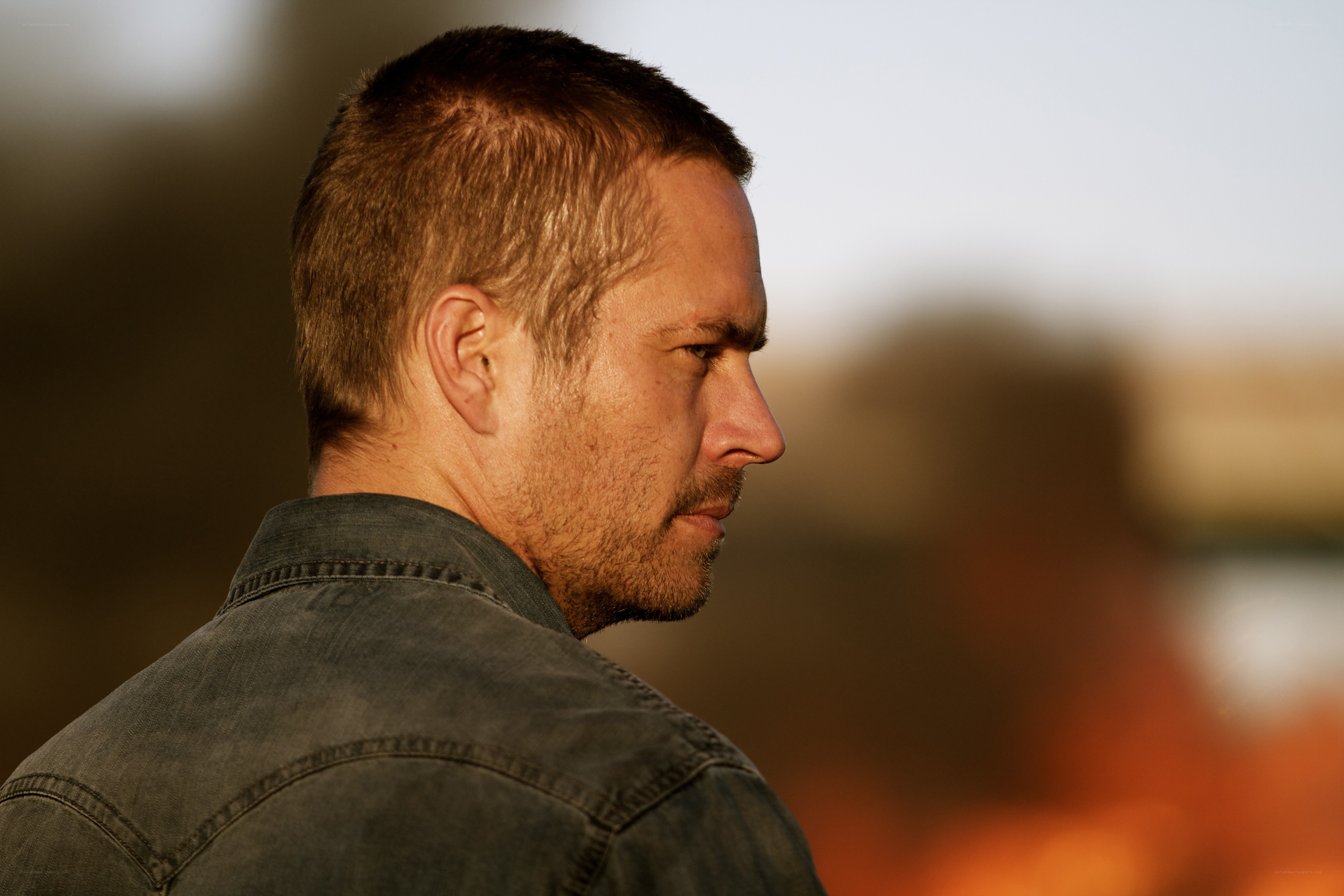 man in denim jacket at sunset