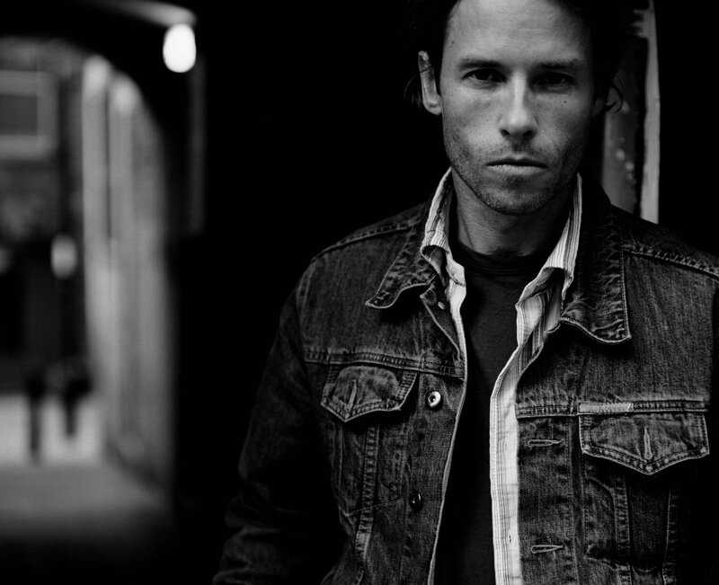 Man in Denim Jacket — Black, Serious, Night