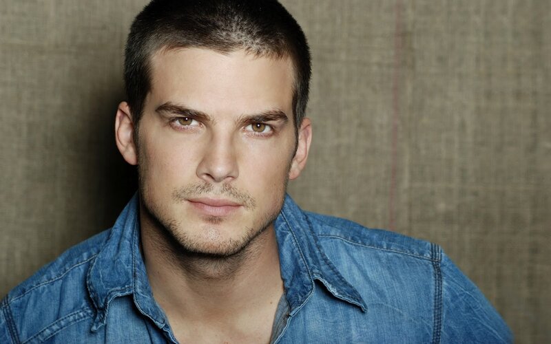man in denim shirt
