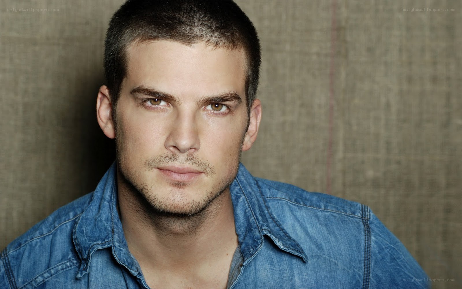man in denim shirt
