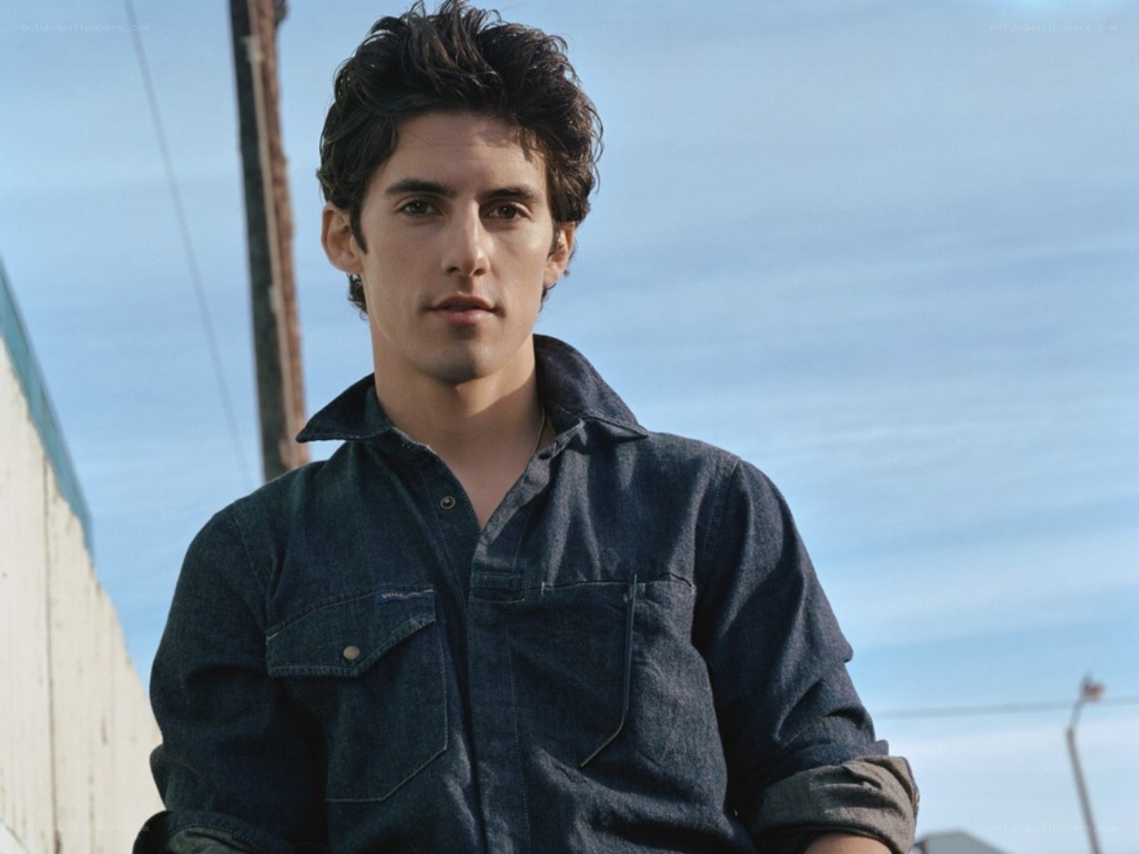 man in denim shirt outdoors