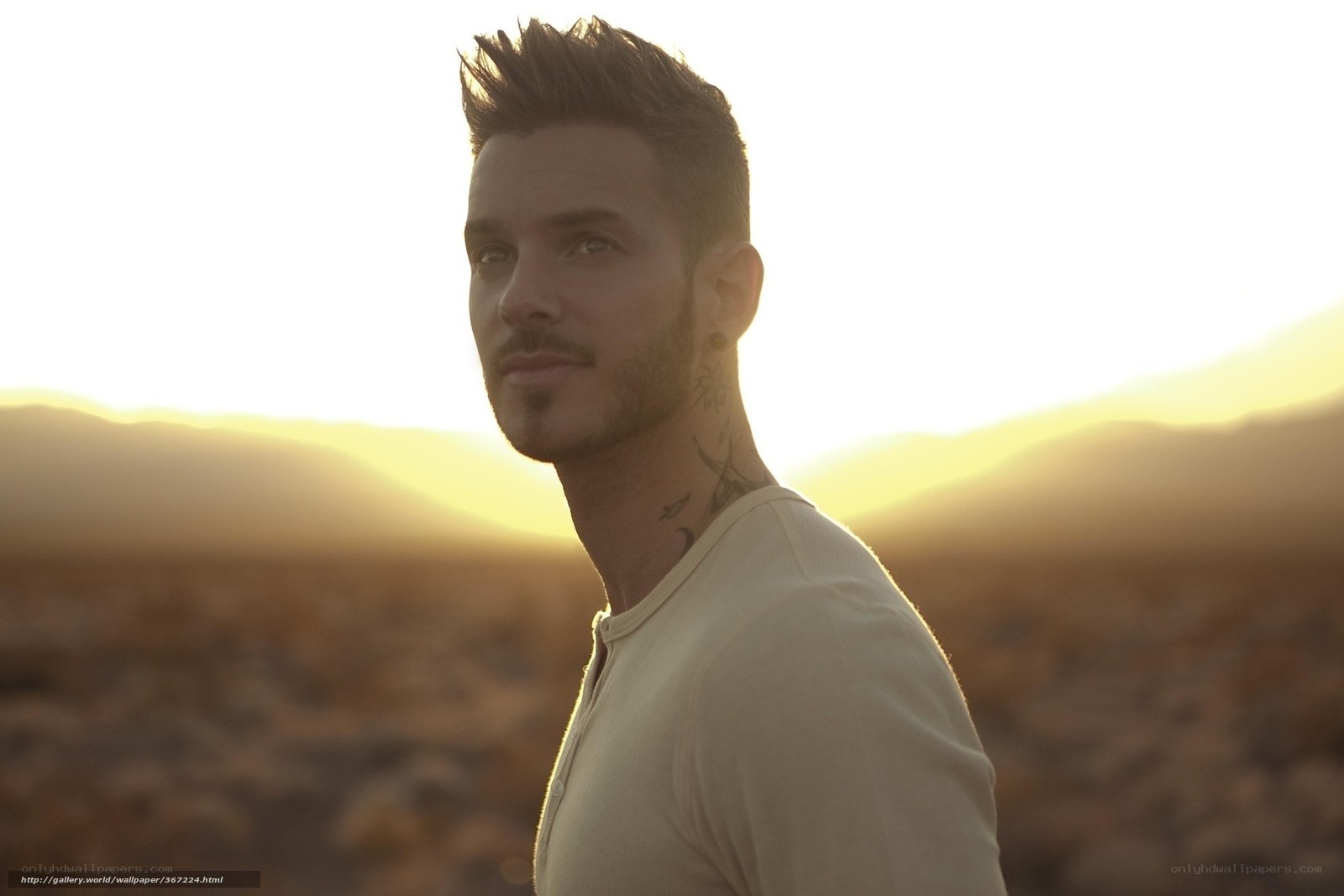 man in desert at sunset