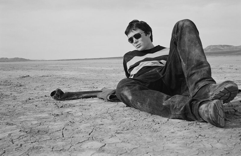 man in desert wearing sunglasses