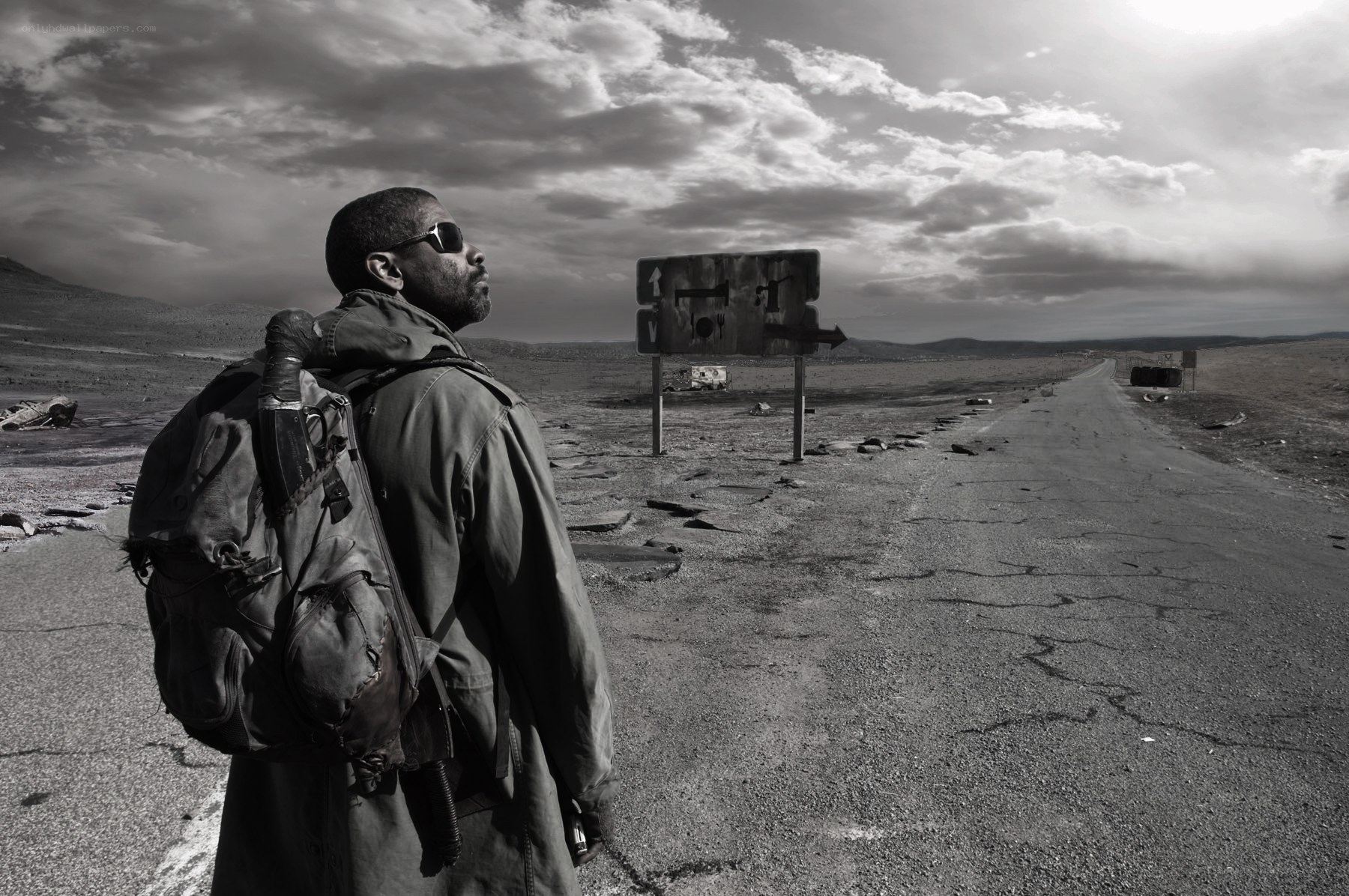 man in desert with backpack