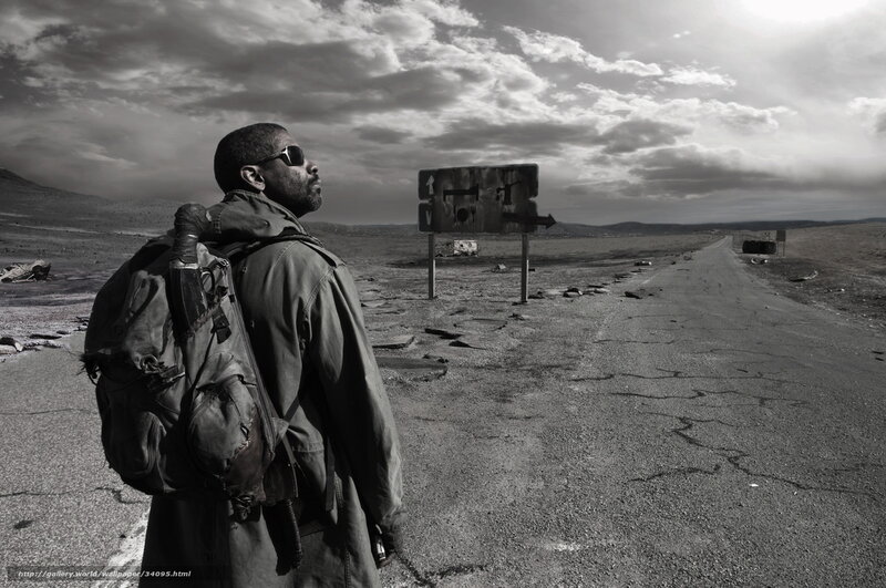 man in desert with backpack