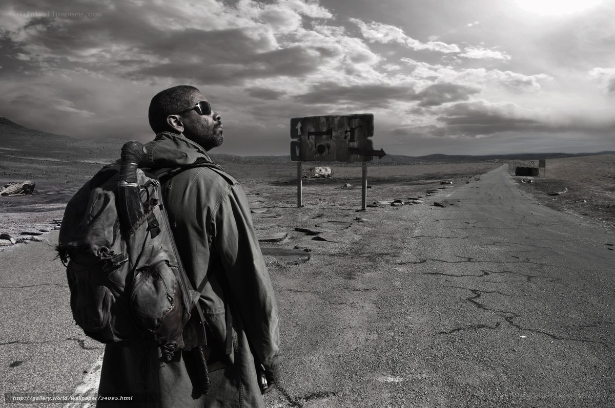 man in desert with backpack