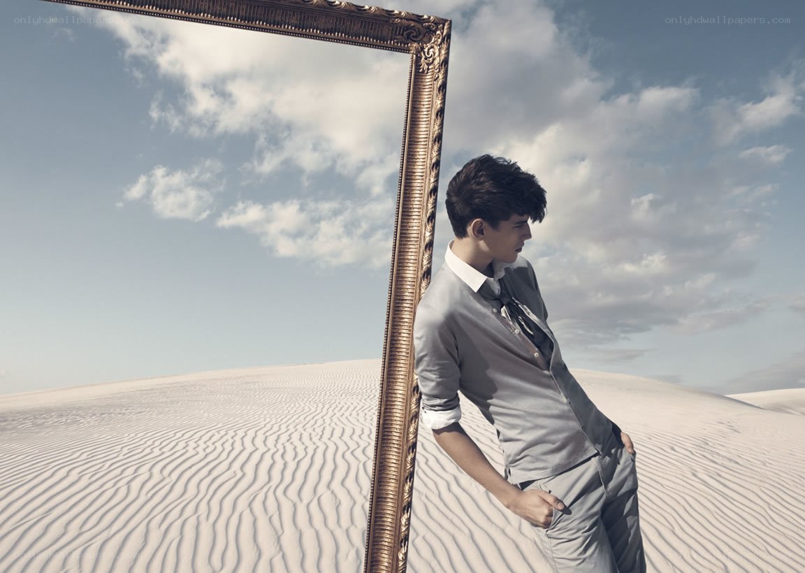 man in desert with frame