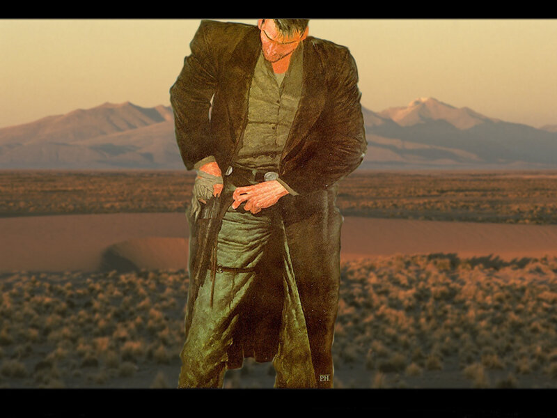 man in desert with gun