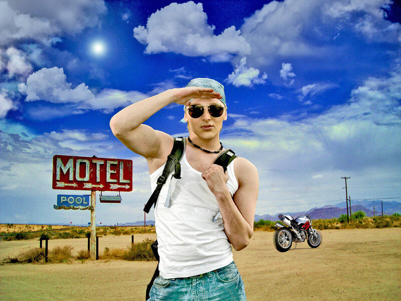 Man in Desert with Motorcycle