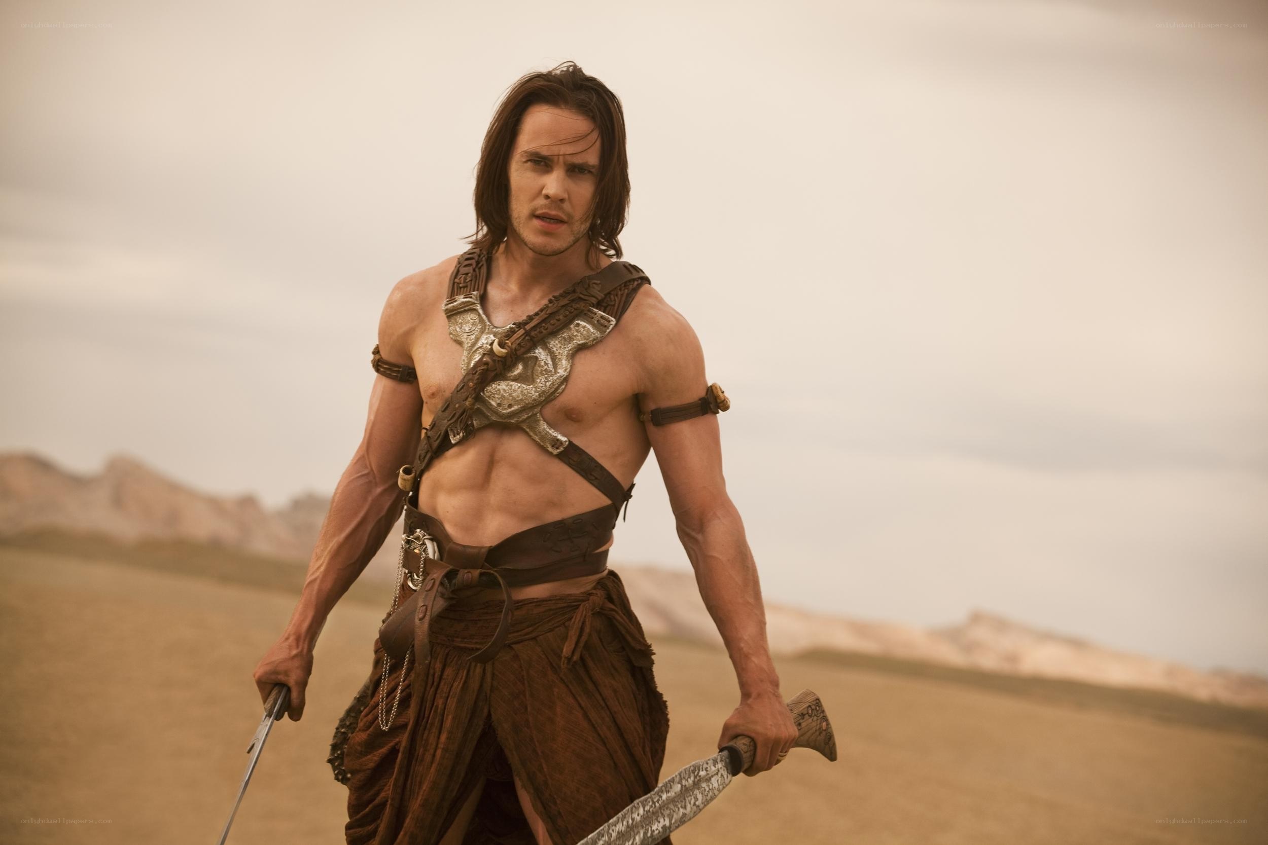 man in desert with swords