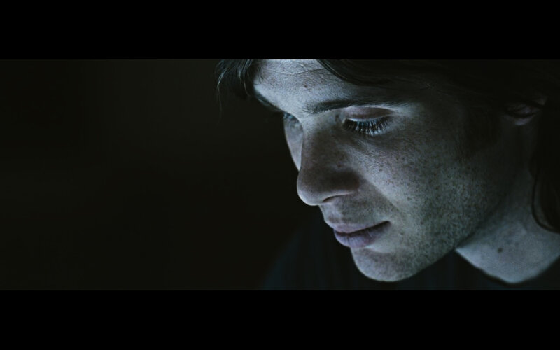 man in dim light