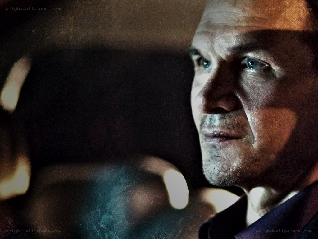 man in dimly lit car