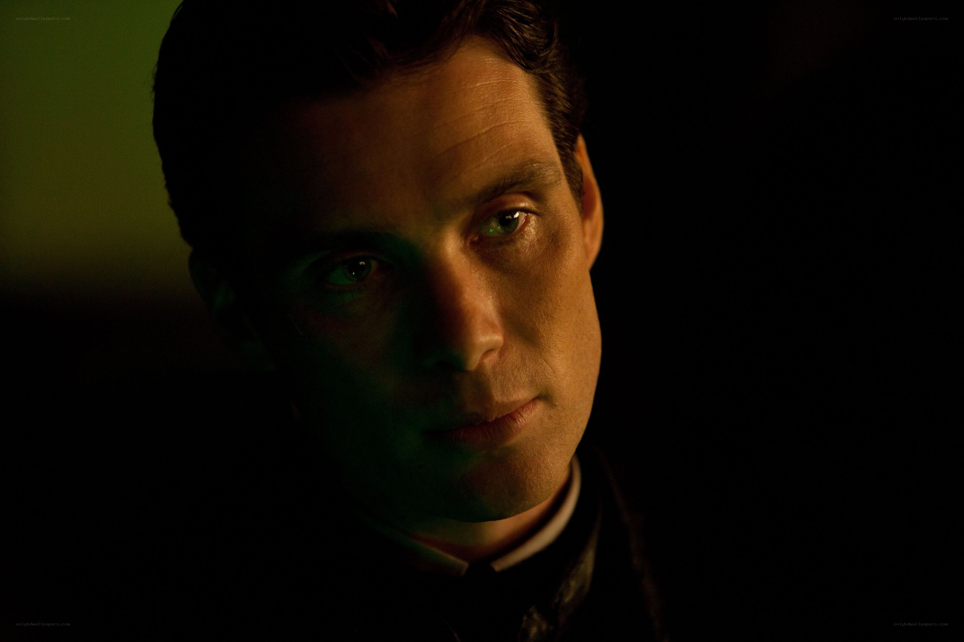 man in dimly lit room