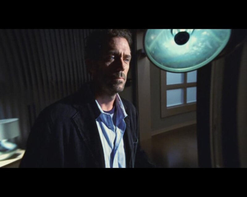 man in dimly lit room