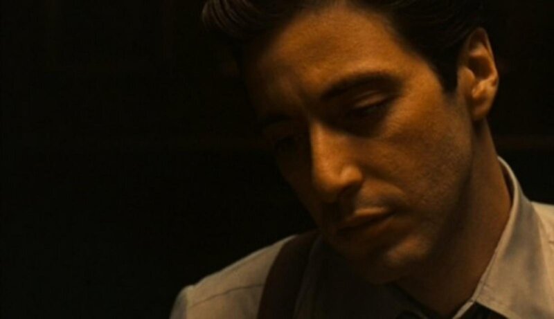 man in dimly lit room