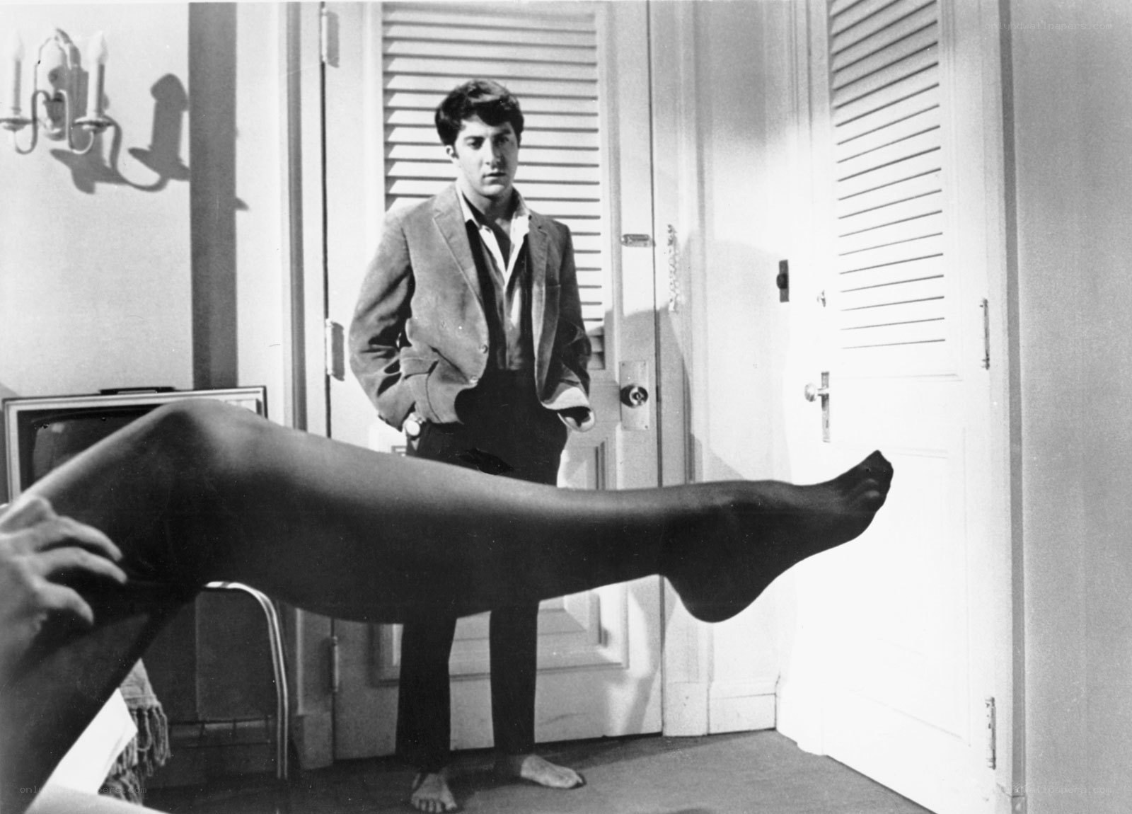 man in doorway with leg