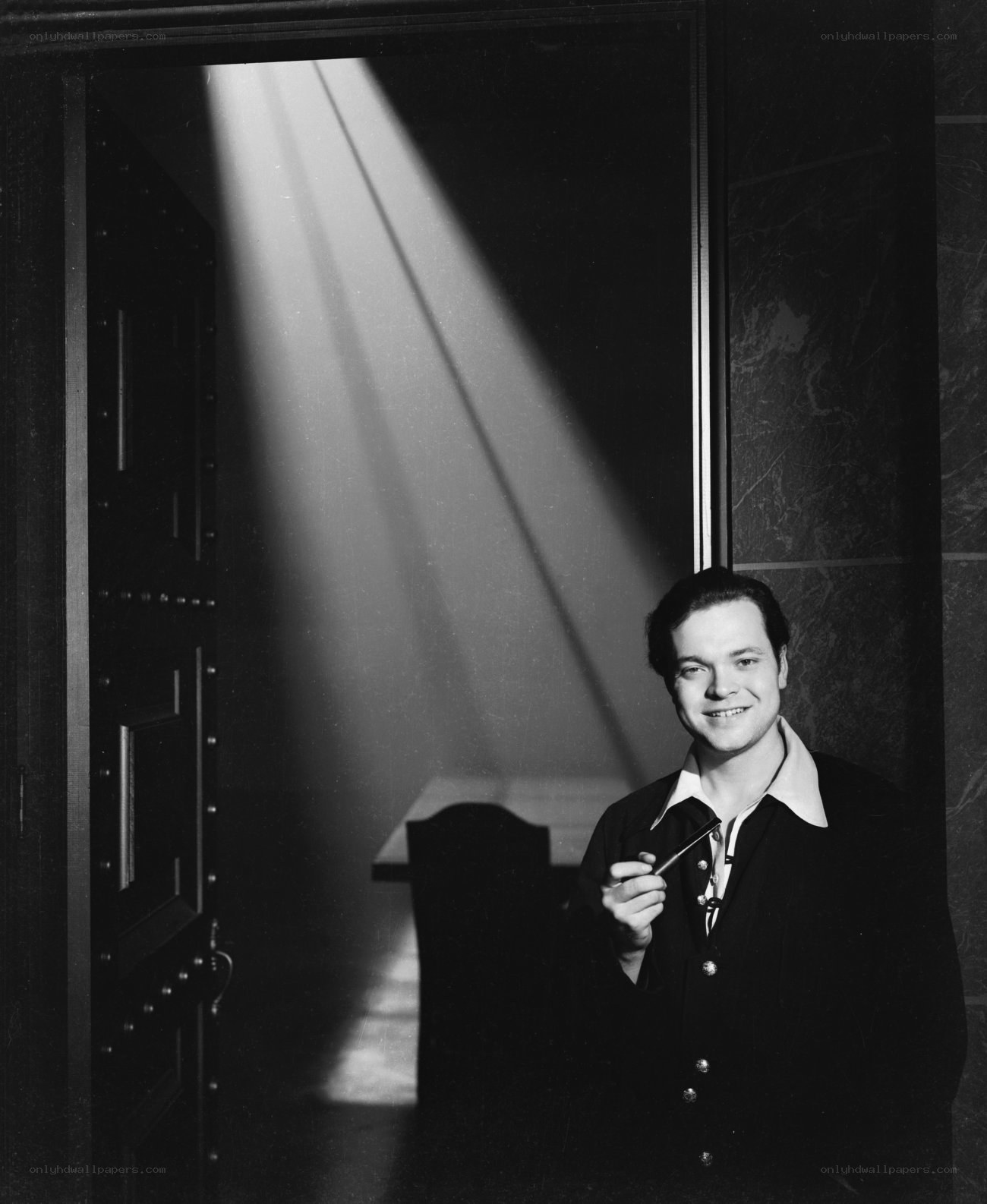 Man in doorway with light beam