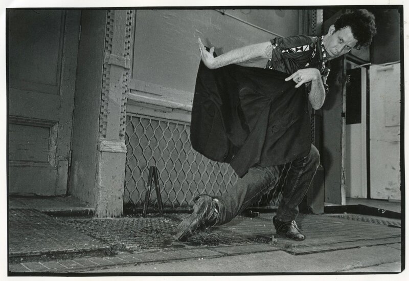 Man in dynamic pose on street