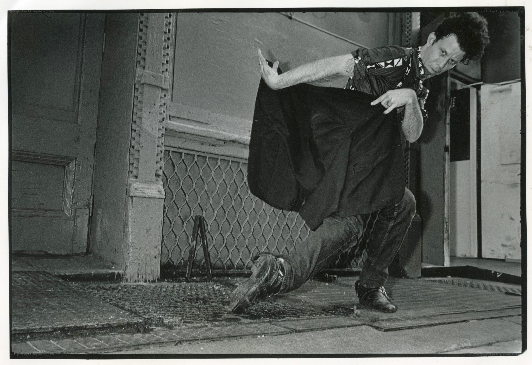 Man in dynamic pose on street