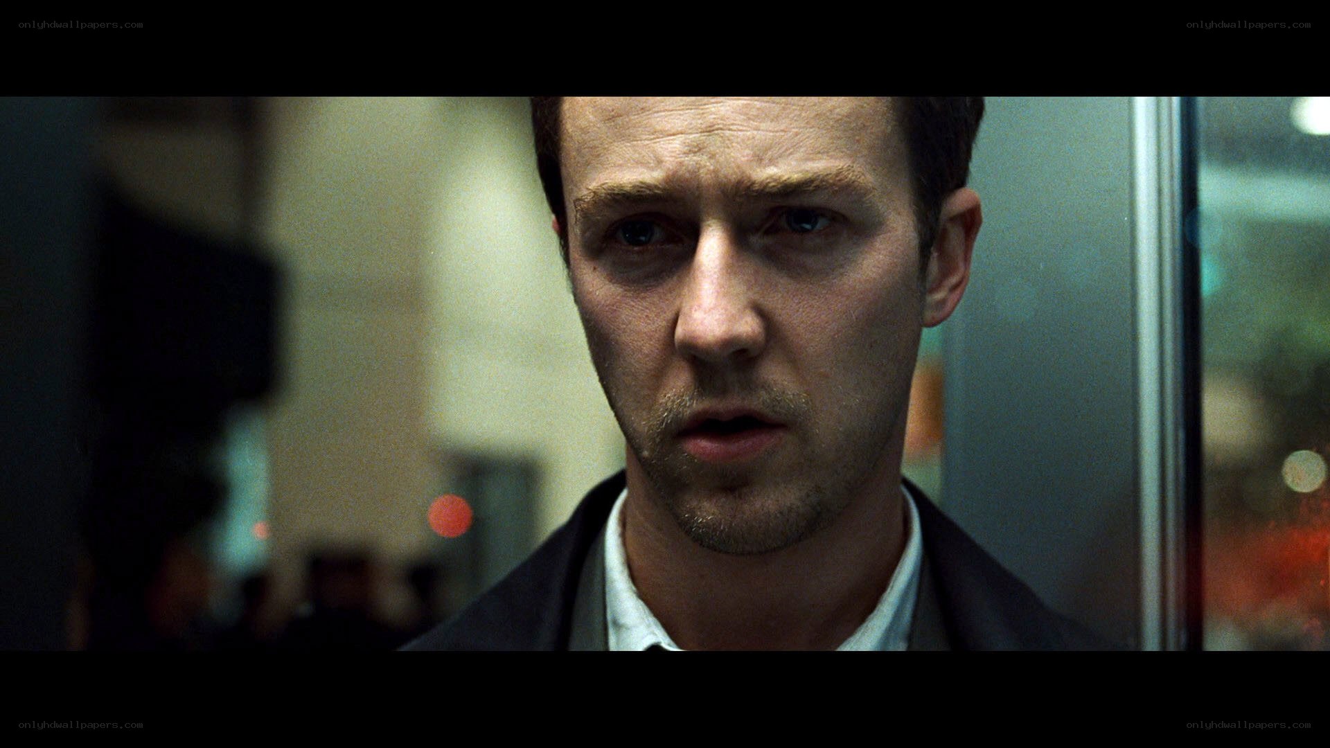 man in elevator looking concerned