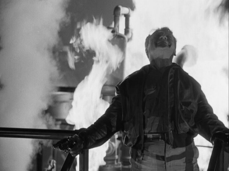 man in flames on ship deck