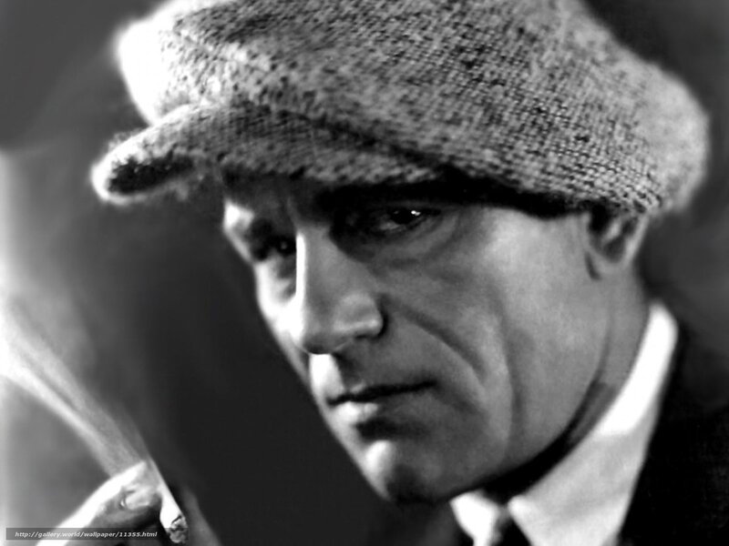 man in flat cap smoking