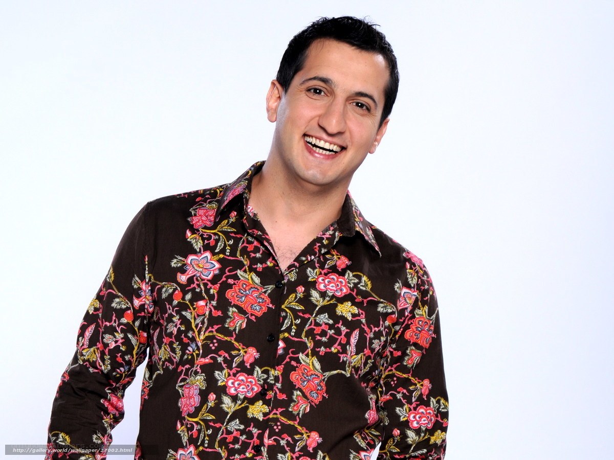man in floral shirt smiling