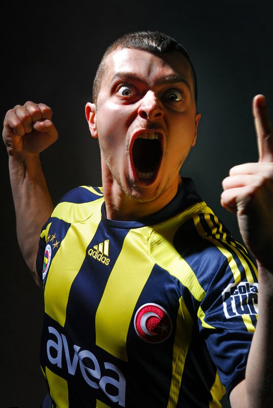 man in football jersey cheering