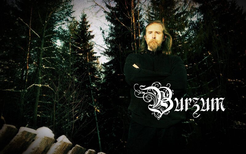 Man in forest with band logo