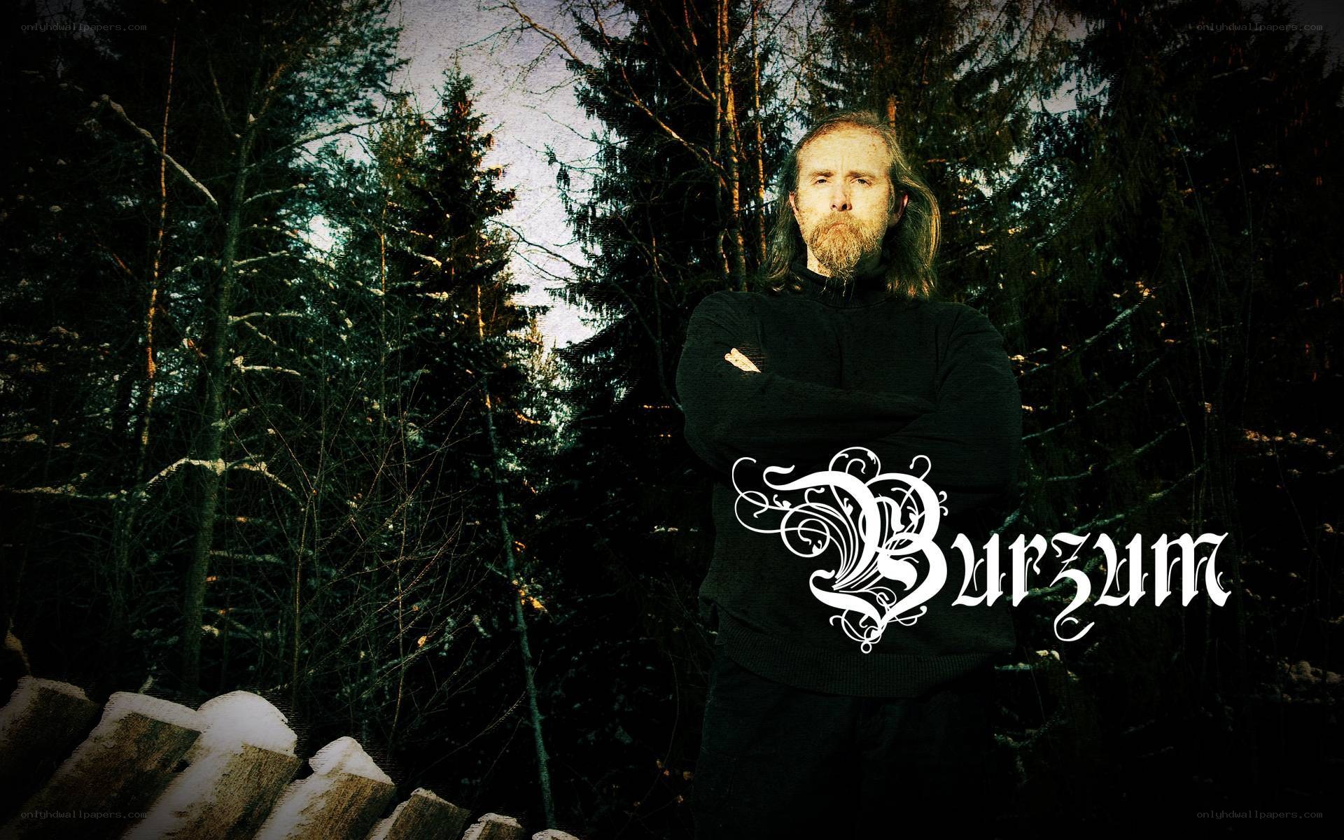 Man in forest with band logo
