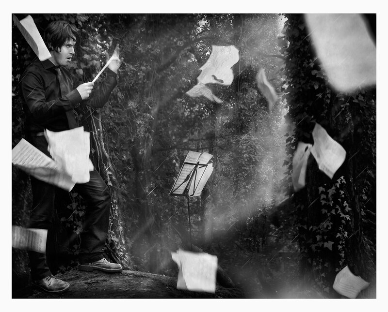 Man in Forest with Papers