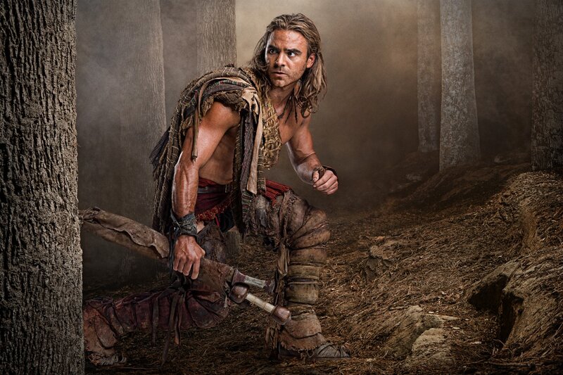 man in forest with sword