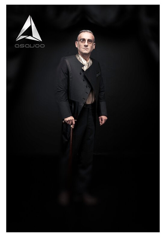 man in formal attire with cane