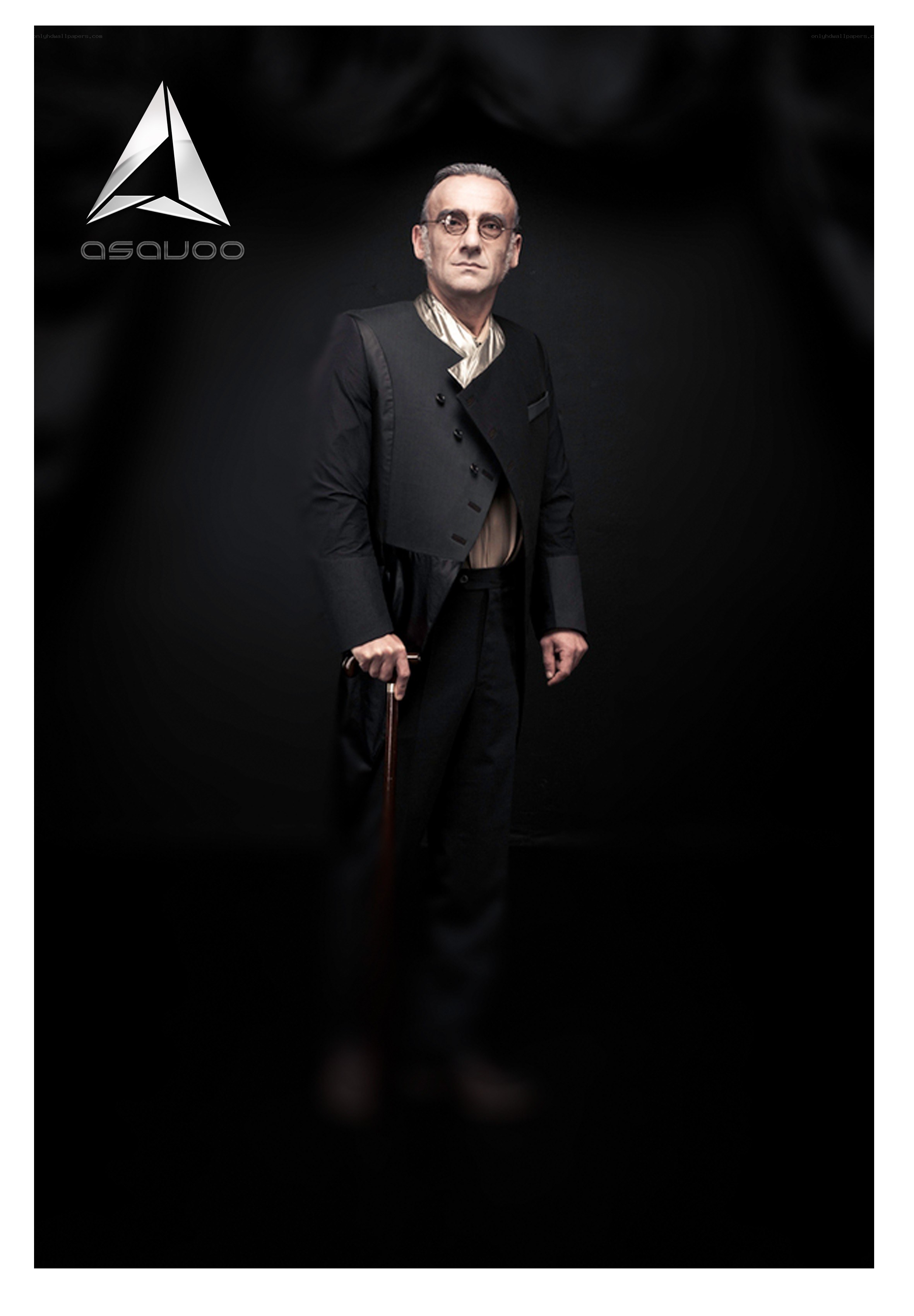 man in formal attire with cane