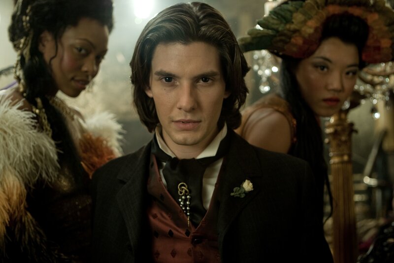 Man in formal attire with women
