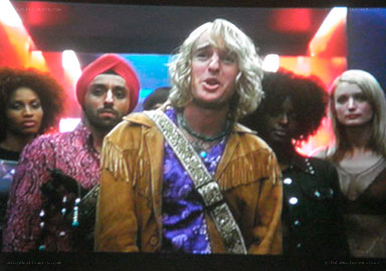 man in fringe jacket singing