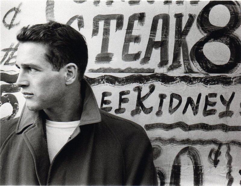 man in front of a sign